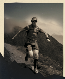 A photo of a man running in the mountains
