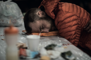 A man asleep with his head on a table