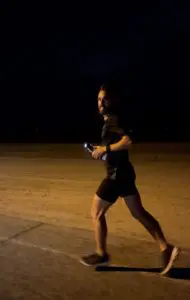 A man running in the dark