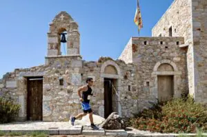 A photo of a man running in Greece
