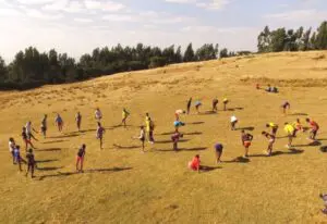 A zoomed out photo of people warming up