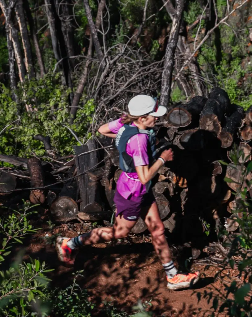 A photo of Katie Schide trail running