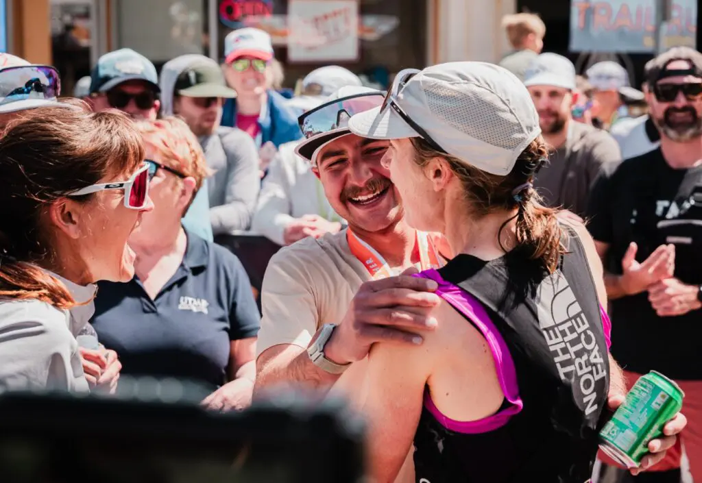 A photo of Katie Schide greeting a friend