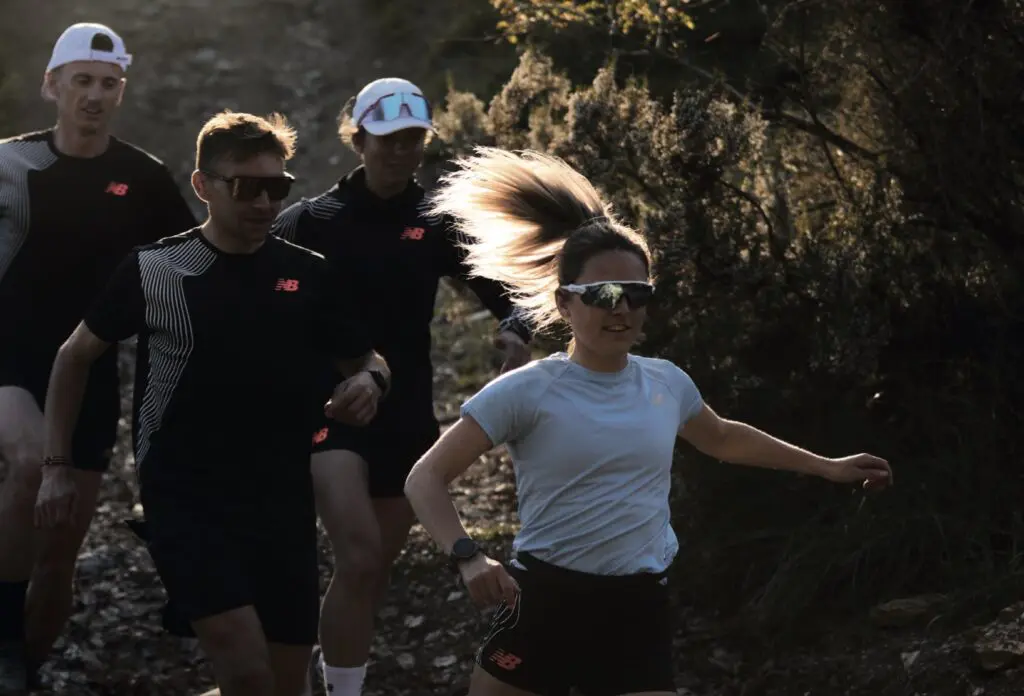 A photograph of people in New Balance attire trail running