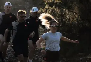 A photograph of people in New Balance attire trail running