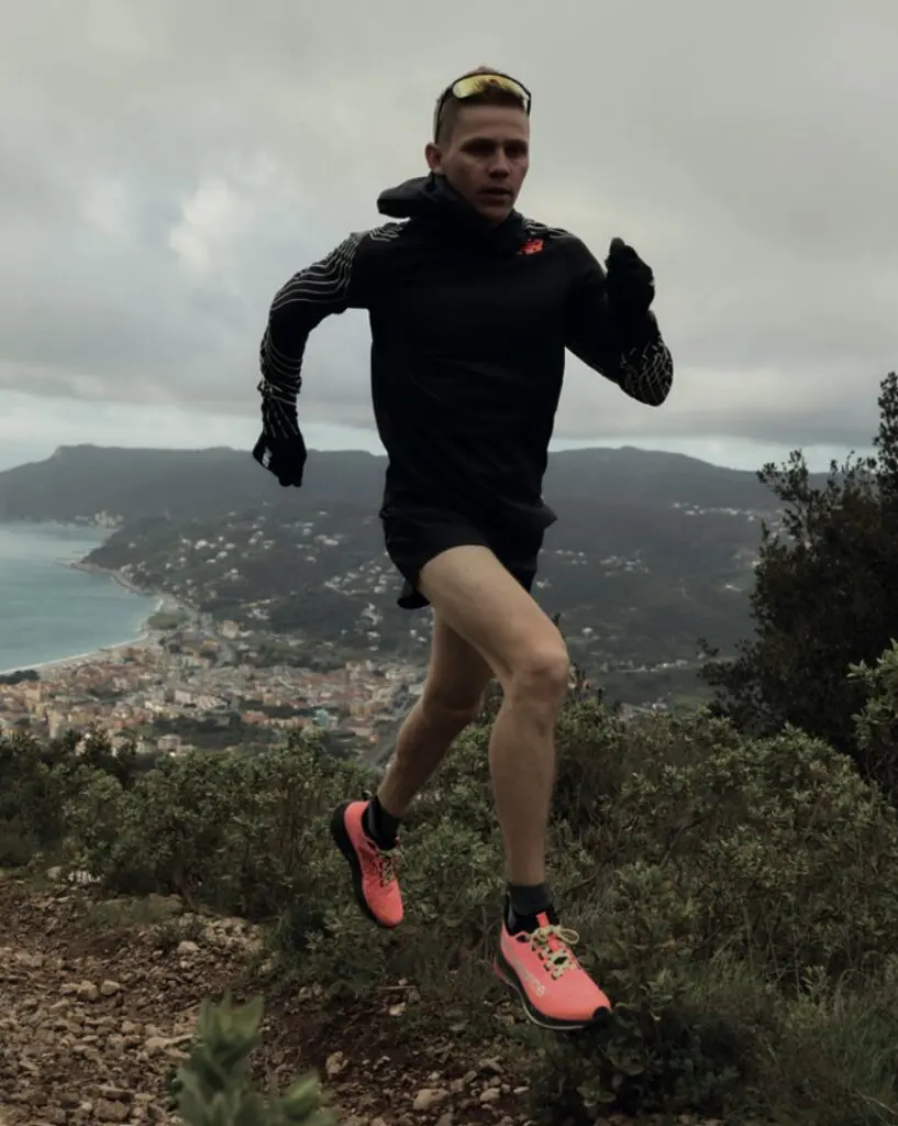 A photo of a man trail running