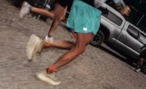 A photo of two people's feet running