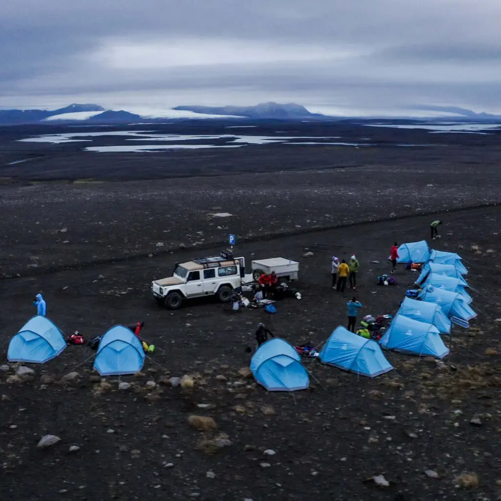 A photograph of lots of tents in a semi circle