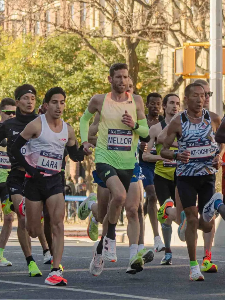 A photograph of Jonny Mellor running in a pack