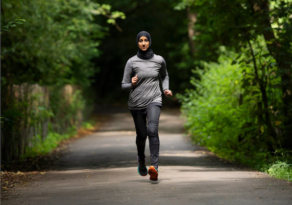 A photograph of a woman running