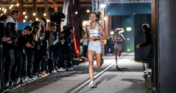 A photograph of a woman running